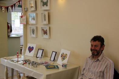 Picture of Teresa Mills mosaic stand being manned by her hubby Paul